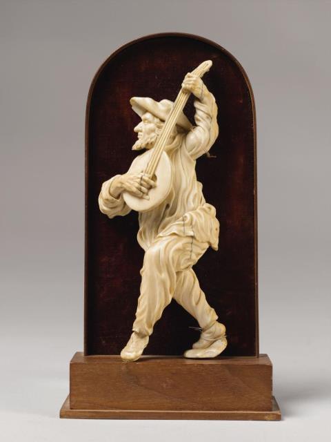 German - A German ivory figure of a man with a guitar, circa 1760/1770.