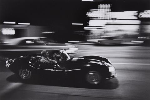 John Dominis - Steve McQueen driving his Jaguar at night, California