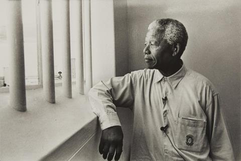 Jürgen Schadeberg - Nelson Mandela in his cell on Robben Island (revisit)