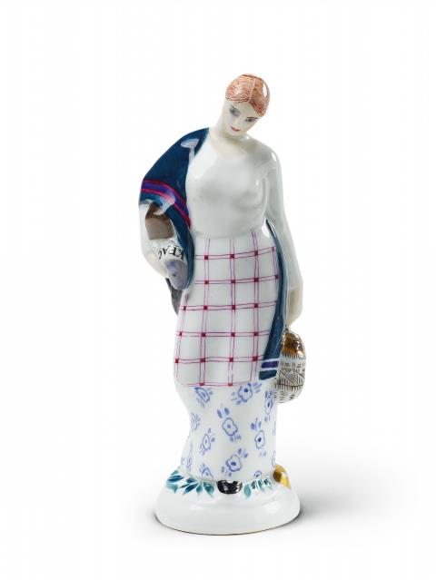 Natalya Danko - A porcelain figure of a young woman returning home from the market with her purchases.