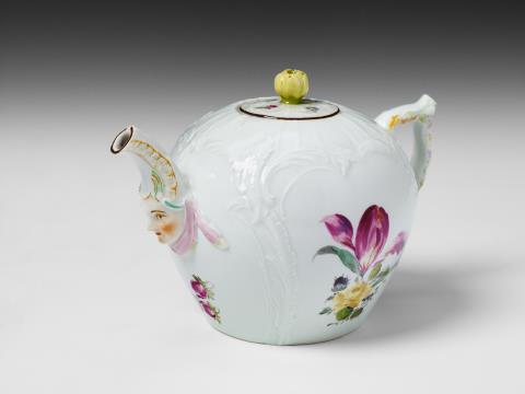 Wilhelm Caspar Wegely - A Berlin KPM porcelain teapot with mascaron and floral decor.