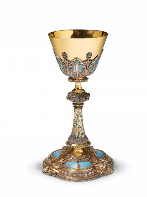 Thomas Joseph Armand-Calliat - A Lyon silver gilt historicist communion chalice. Set with diamonds and coloured stones and with slightly worn enamelled biblical decor. With an engraved dedication "+ L. L. PÂQUES 1877." to the underside. Marks of Thomas Joseph Armand-Calliat, ca. 1870.