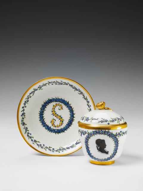 A Höchst porcelain neoclassical covered cup and saucer.
