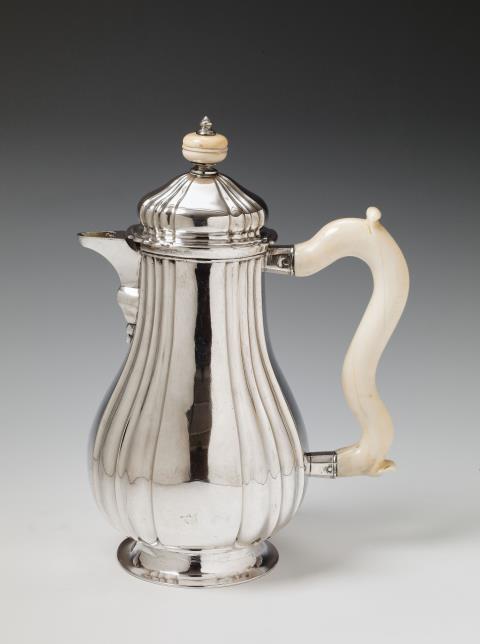 Johann Leonhard Heinen - A rare Kempen silver interior gilt coffee pot. The handle and finial of ivory. Johann Leonhard Heinen, 1756 - 59.