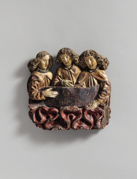  Central Rhine Region - A probably Central Rhenish carved wooden relief of three angels among clouds, second half 15th century.