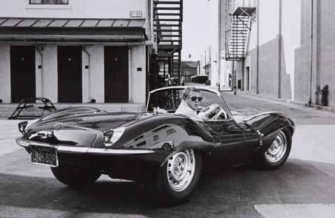 John Dominis - Steve McQueen in black Jaguar at Studio, CA