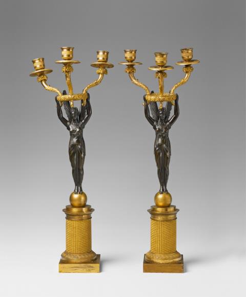 Pierre-Philippe Thomire - A pair of Parisian ormolu candelabra modelled as allegories of victory.