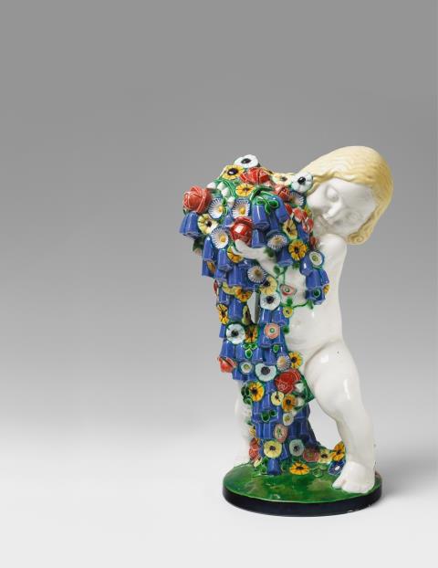 Michael Powolny - A Vienna ceramic figure of a putto as an allegory of spring.