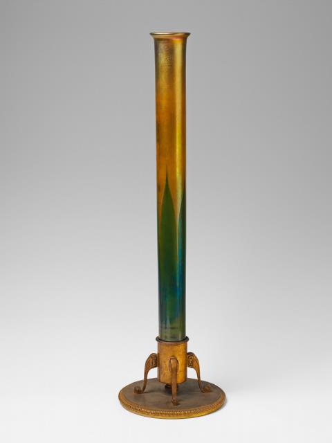  Tiffany Studios New York - A tall, golden favrile glass vase with green overlay.