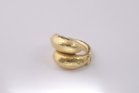 Ilias Lalaouins - A 22k gold crossover ring.
