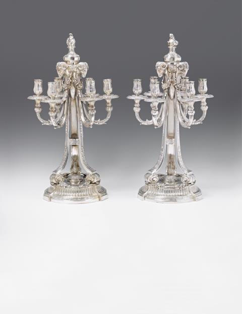 A pair of opulent Heilbronn silver candelabra