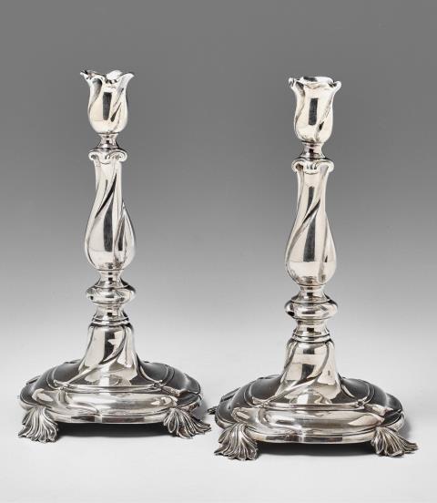 Cornelius de Haan - A pair of Dutch silver candlesticks