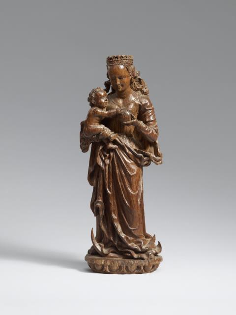 Flemish circa 1520/1530 - A Flemish carved oak figure of the Virgin and Child, circa 1520/1530.