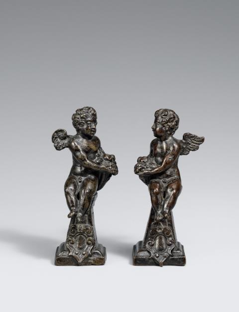  Venice - Two Venetian bronze figures of putti with cornucopias, first half 17th century.