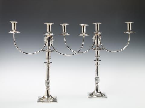 August Wilhelm Lienemann - A pair of Berlin silver three-flame girandoles. Marks of Georg Wilhelm Lienemann, 1817 - 19.