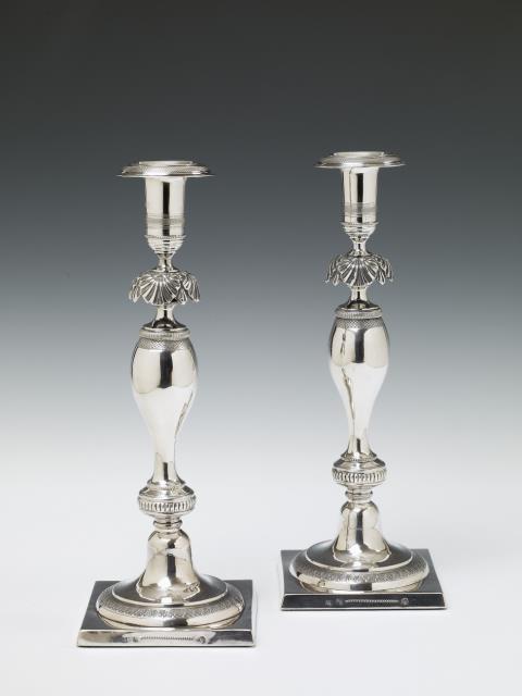 Johann George Wilhelm Heinicke - A pair of Berlin silver Biedermeier candlesticks. Marks of Johann George Wilhelm Heinicke, ca. 1830/40.