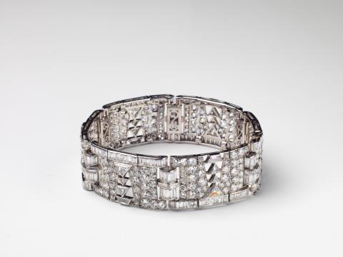 Maison Boucheron - A French platinum, 18k gold and diamond Art Deco bracelet with Boucheron retailer's mark