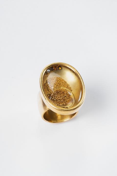 Falko Marx - An 18k gold and rock crystal capsule ring filled with water and diamonds by Falko Marx