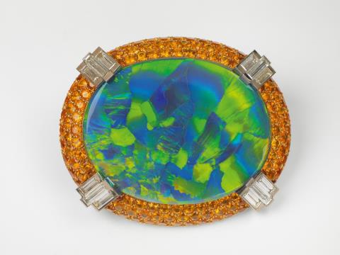 Gebrüder Hemmerle - An 18k gold, diamond and mandarin garnet brooch with a rare large harlequin opal by Hemmerle, Munich