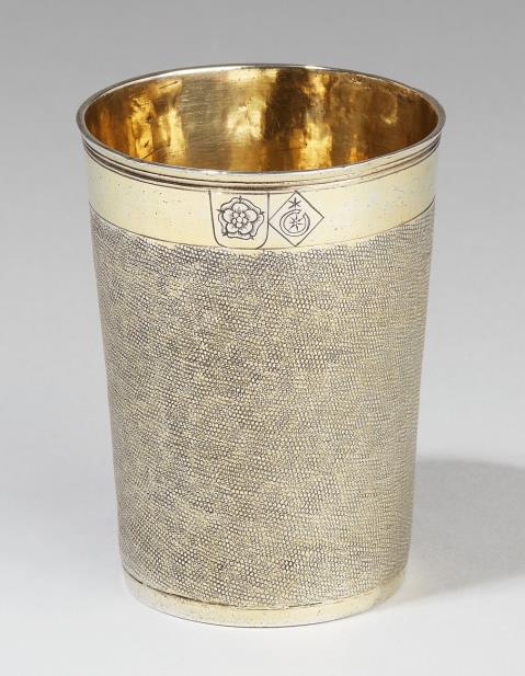 Lorenz Tittecke - A Nuremberg partially gilt silver snakeskin beaker. Engraved with a small arms of alliance and with weight "3 1/10" to the underside. Marks of Lorenz Tittecke, 1609 - 26.