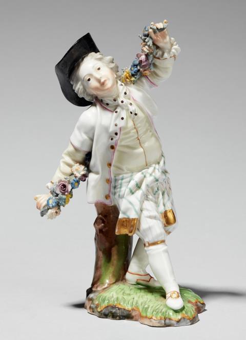 A Höchst porcelain model of a dancer with a garland