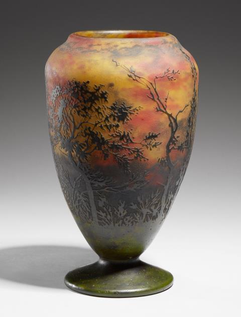 A Daum Frères etched overlay glass vase with landscape decor