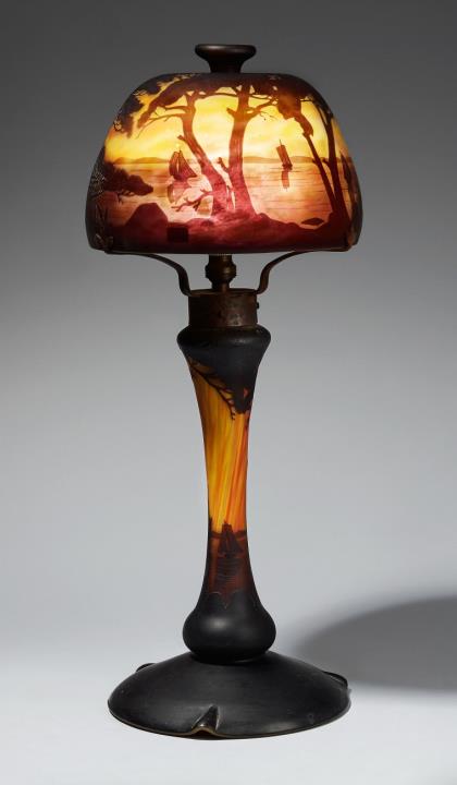 A Daum Frères 'paysage lacustre' etched overlay glass table lamp