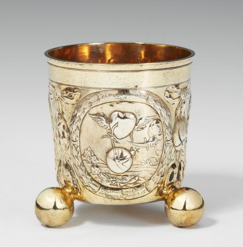 Adolf Gaap - An Augsburg parcel gilt silver beaker with emblems. Marks of Adolf Gaap, 1691 - 95.