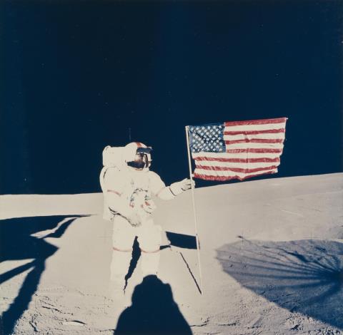NASA - Apollo 14, Astronaut Alan B. Shepard Jr. plants the American flag on the moon