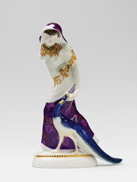 Adolph Amberg - A Berlin KPM porcelain figure of an Indian lady with a peacock