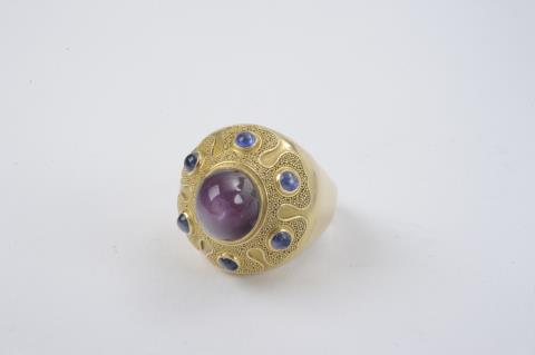 Wilhelm Nagel - An 18k gold, ruby, and sapphire ring made by Wilhelm Nagel