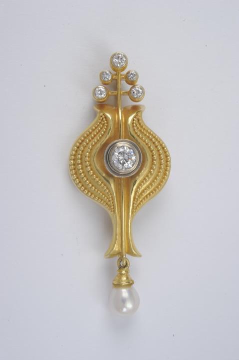 Wilhelm Nagel - An 18k gold and diamond pendant brooch made by Wilhelm Nagel