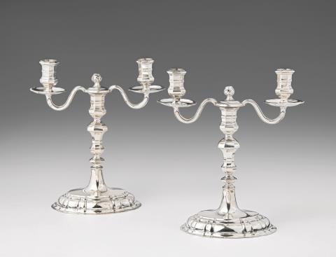 George Kahlert the elder - A pair of Breslau silver candlesticks with candelabra branch attachments