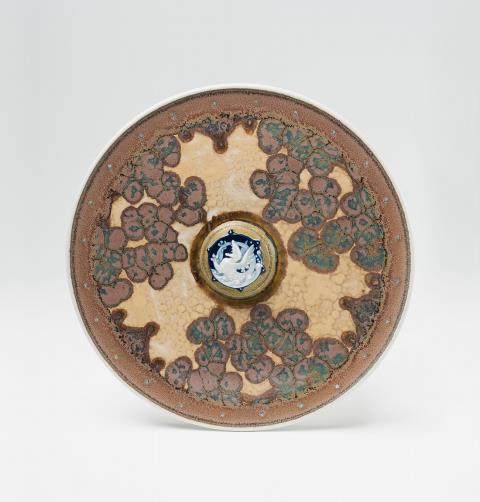 A Sèvres porcelain platter with dragon decor by Taxile Doat