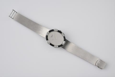 Chopard - An 18k white gold, onyx and diamond ladies wristwatch