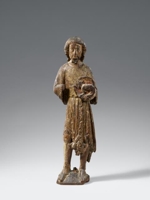  Alpenländisch - A carved wooden figure of John the Baptist, probably Alpine, 1st quarter 15th century