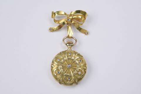 Longines - An 18k gold bow brooch with a watch pendant