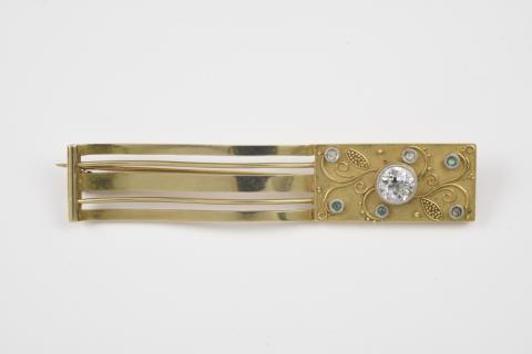 Elisabeth Treskow - A 14k gold and diamond fibula brooch