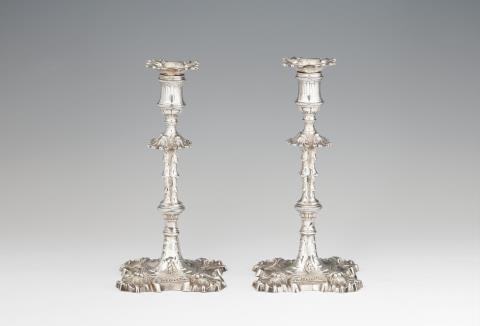 William Sampel - A pair of George II silver candlesticks