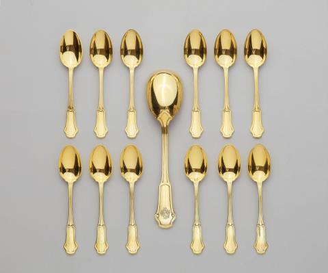 Gustave Keller - A Parisian silver gilt cream spoon and 12 coffee spoons