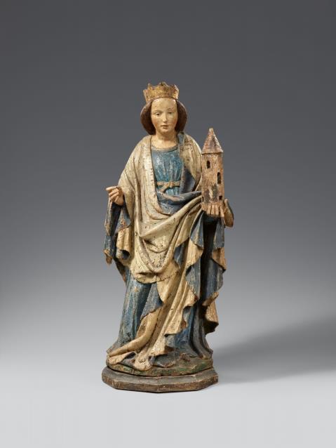  Austria - An early 15th century Austrian carved wooden figure of Saint Barbara