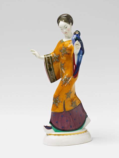 Adolph Amberg - A Berlin KPM porcelain figure of a Japanese lady with a parrot