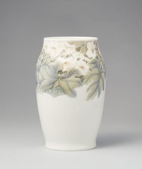  Bing & Grøndahl - A Bing & Grøndahl porcelain vase with flowers in relief