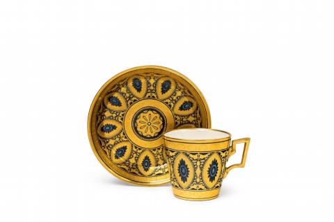 A Vienna porcelain cup and saucer with arabesque decor