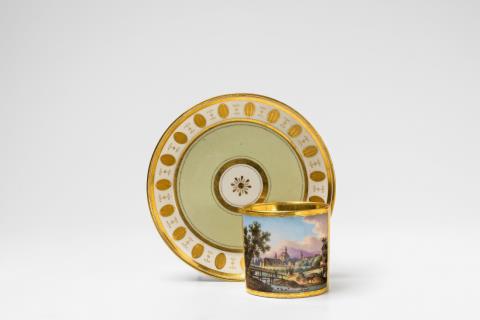 Anton Kothgasser - A Vienna porcelain cup and saucer with a view of Mödling