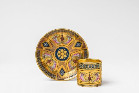 A Vienna porcelain cup and saucer with Etruscan vases
