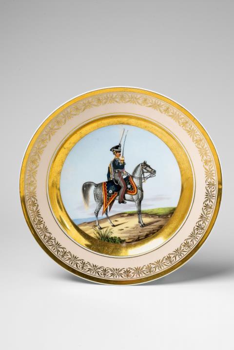 Franz Krüger - A Berlin KPM porcelain plate with Prussian cavalrymen