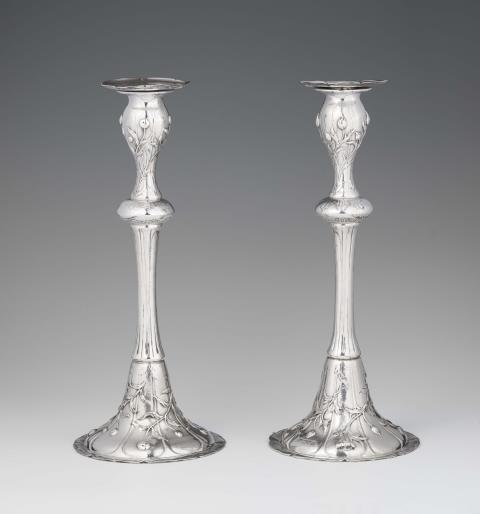 Gilbert Marks - A rare pair of Arts and Crafts silver candlesticks