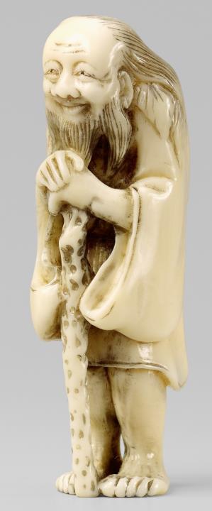  Nuremberg - A marine ivory netsuke of a smiling old sennin. 19th century