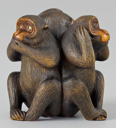 A wood netsuke of the Three Wise Monkeys